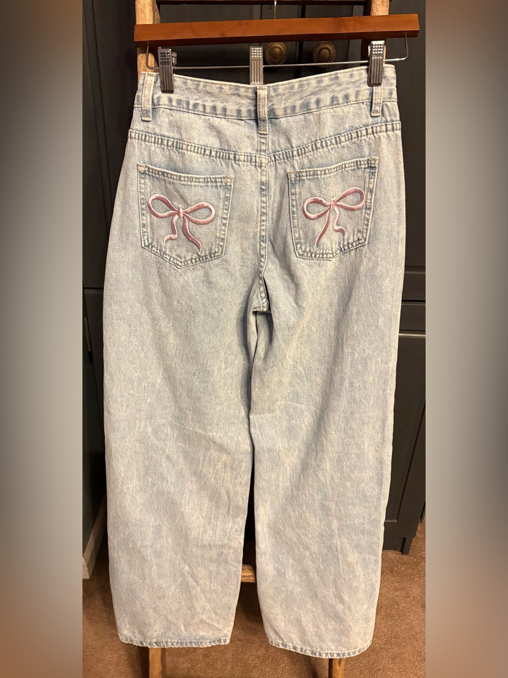 SHEIN Light Blue Flare Jeans with pink bow detail on back pockets